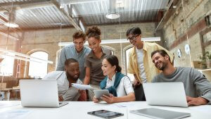 Office employees in casual dress code working together happily