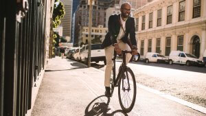 Businessman cycling to work