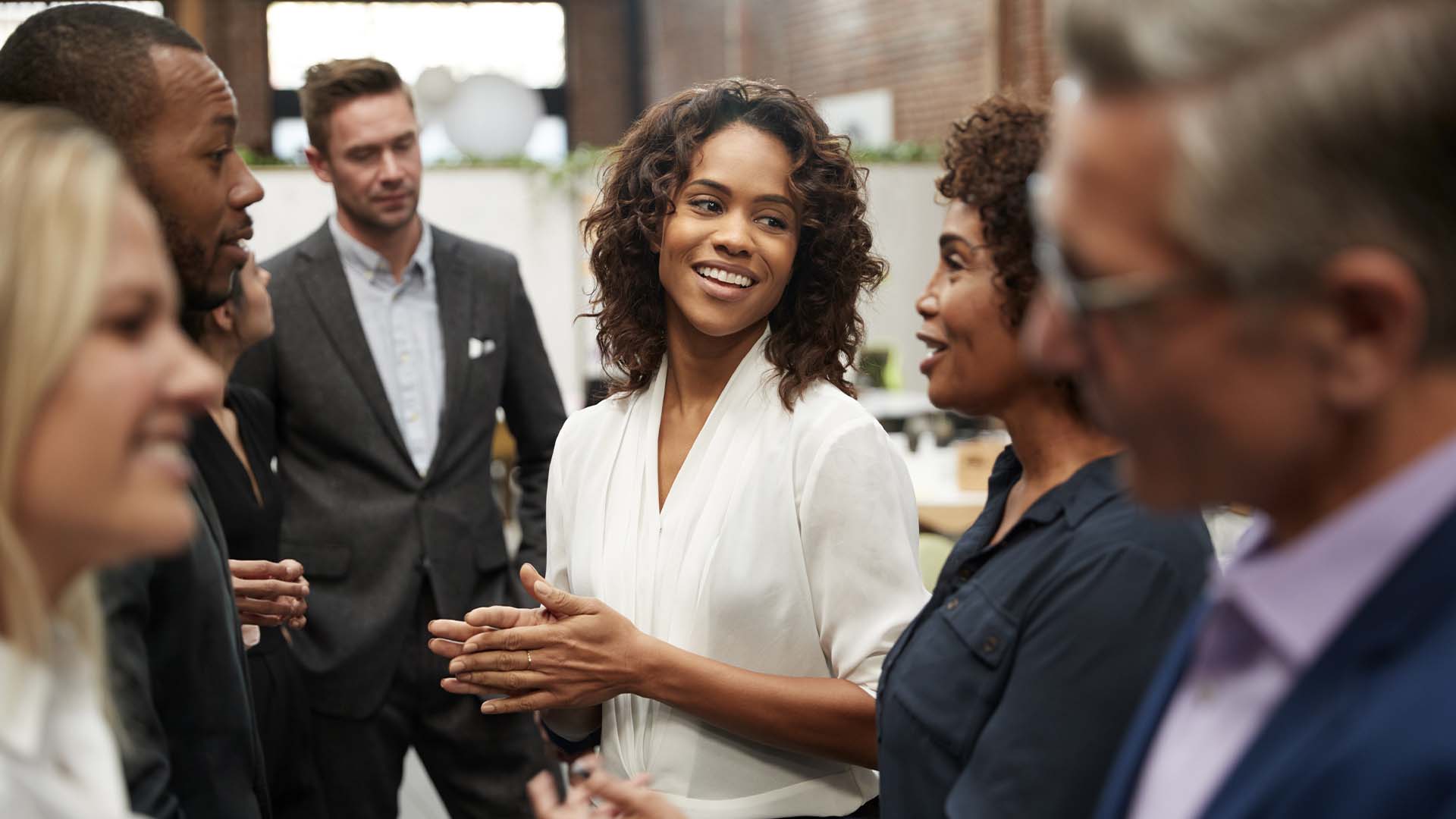 Female CEO with their work collegues