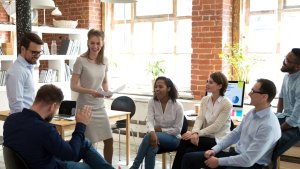 A buinsess team in the office having a friendly chat