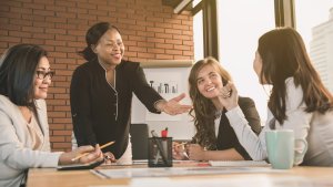 Four women in a business meeting