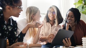 Four women in serior management roles having a business meeting