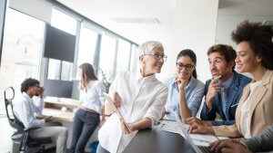 CEO chatting with employees