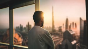 Business owner looking out the office window