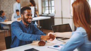 Employee ending a meeting with a handshake