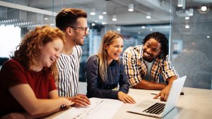 People in an office smiling