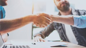 People shaking hands in an office