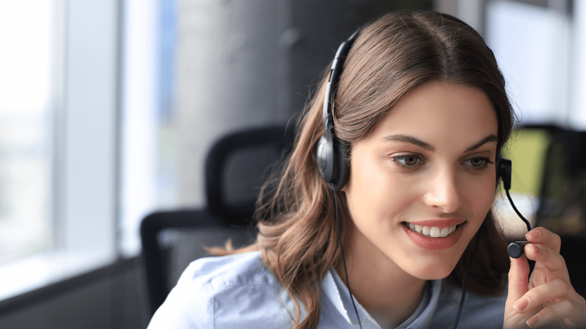 call center worker in headphones is working at modern office