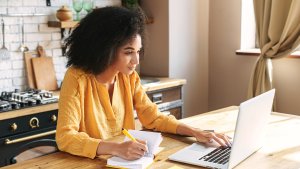 woman is using laptop computer for remote work