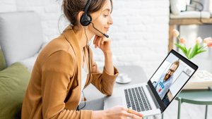 Business woman having a video call with co-worker