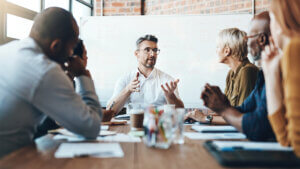 Shot of a businessman leading a meeting in the boardroom