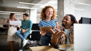 Business people having fun, brainstorming and chatting at workplace office