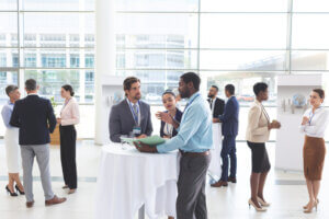 Business people discussing over documents at table during a semi