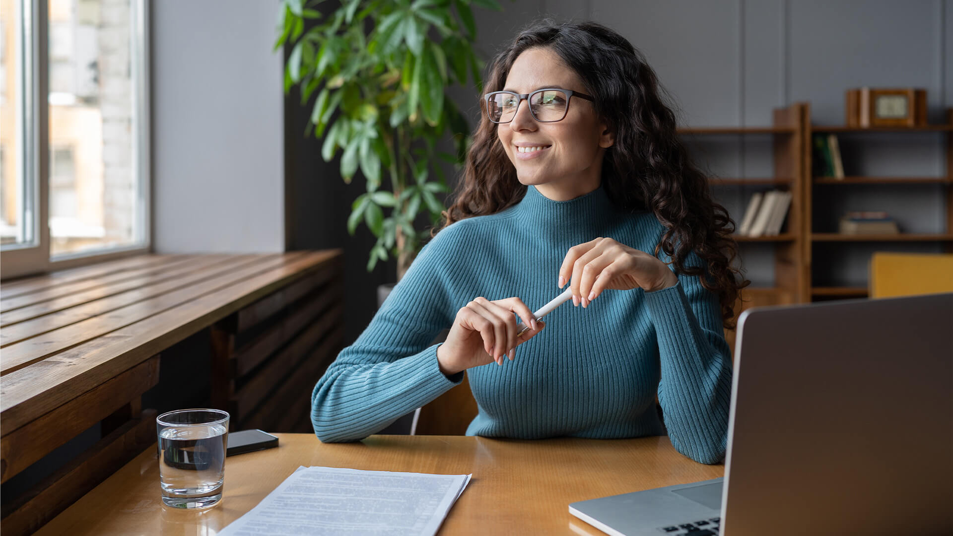 Positive happy female employee resting at workplace