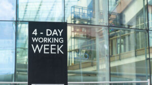 4 - Day working week on a city-center sign in front of a modern office building