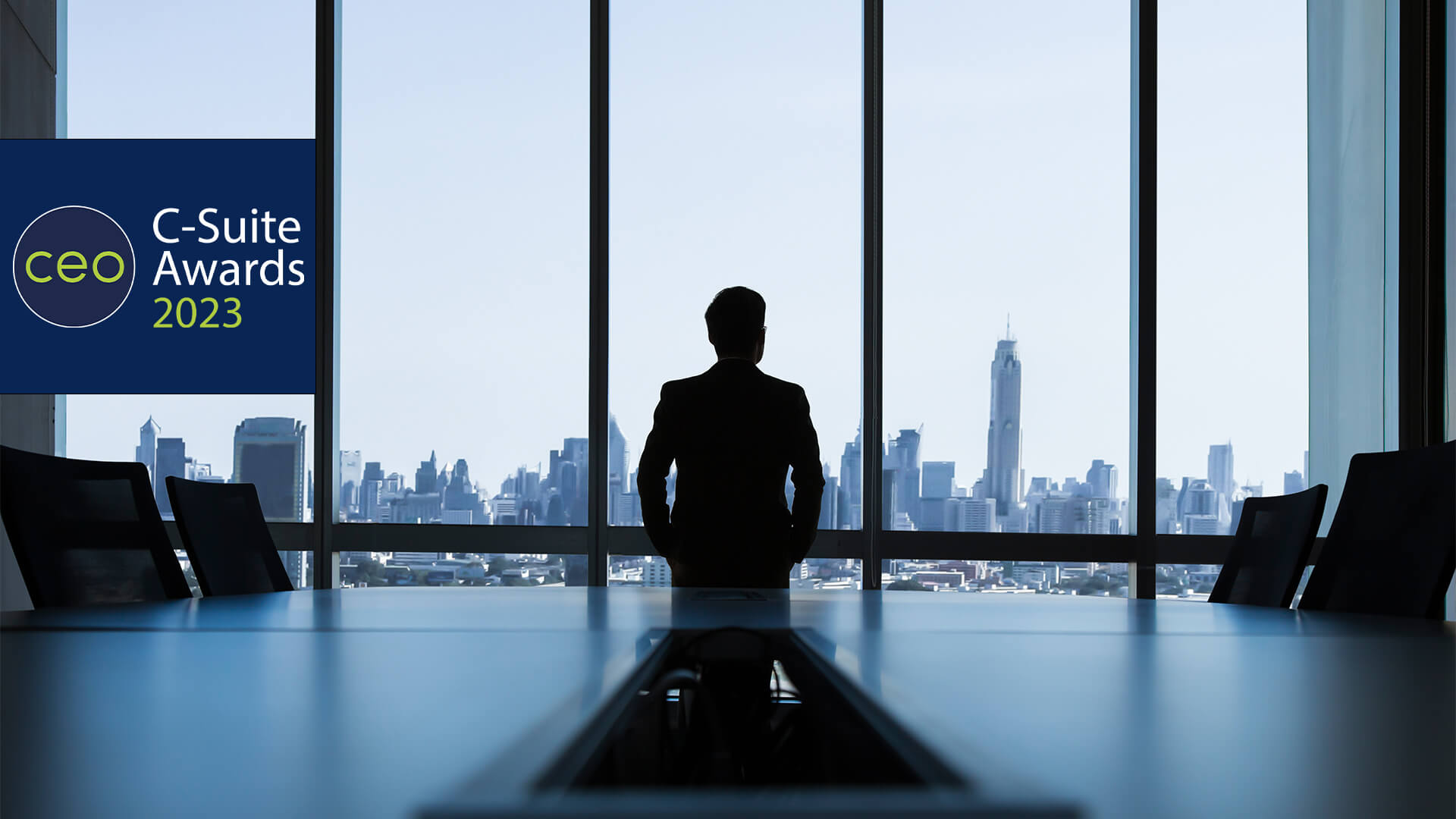 man looking out of window