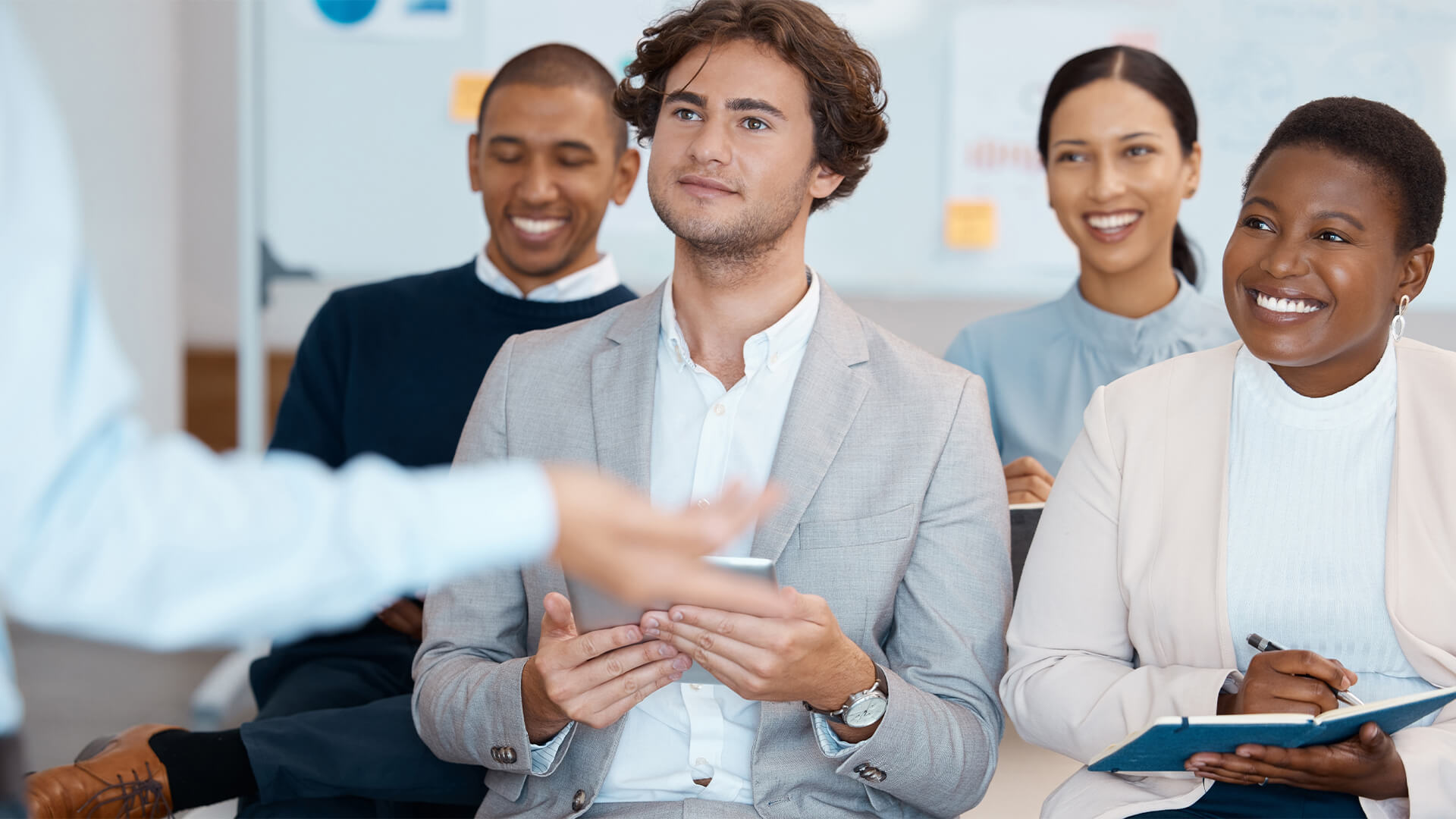 Audience, listening and training with a team in a meeting, seminar or workshop for learning and development