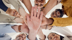 Hands, stack and team building, business people and support with winning, planning and mission, low angle and trust.