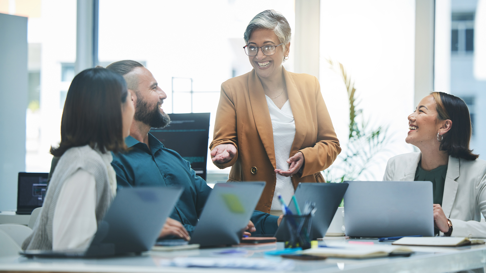 Happy people, laptop and meeting, marketing team and workflow