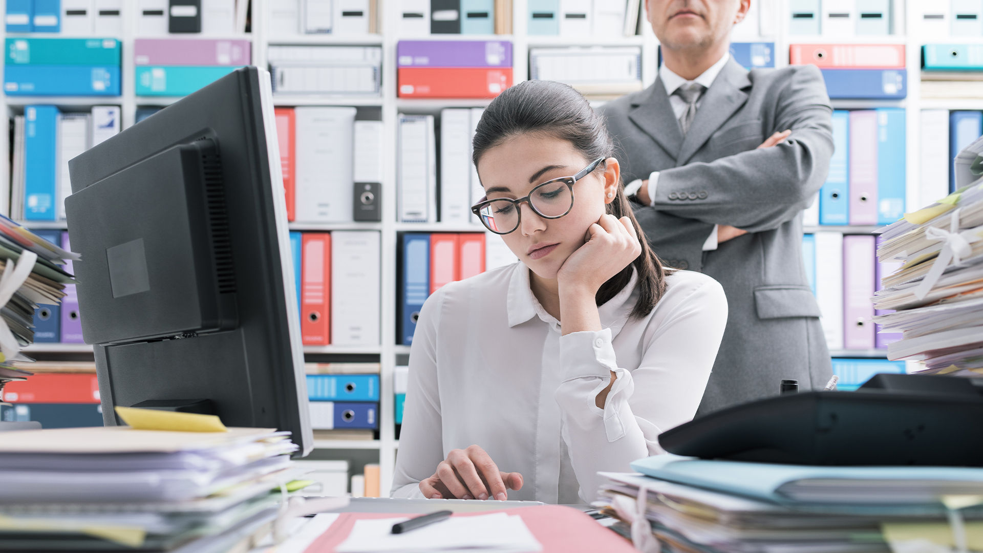 Boss watching over his employee