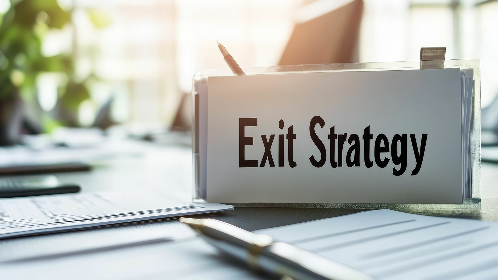 Desk documents display exit strategy plan.