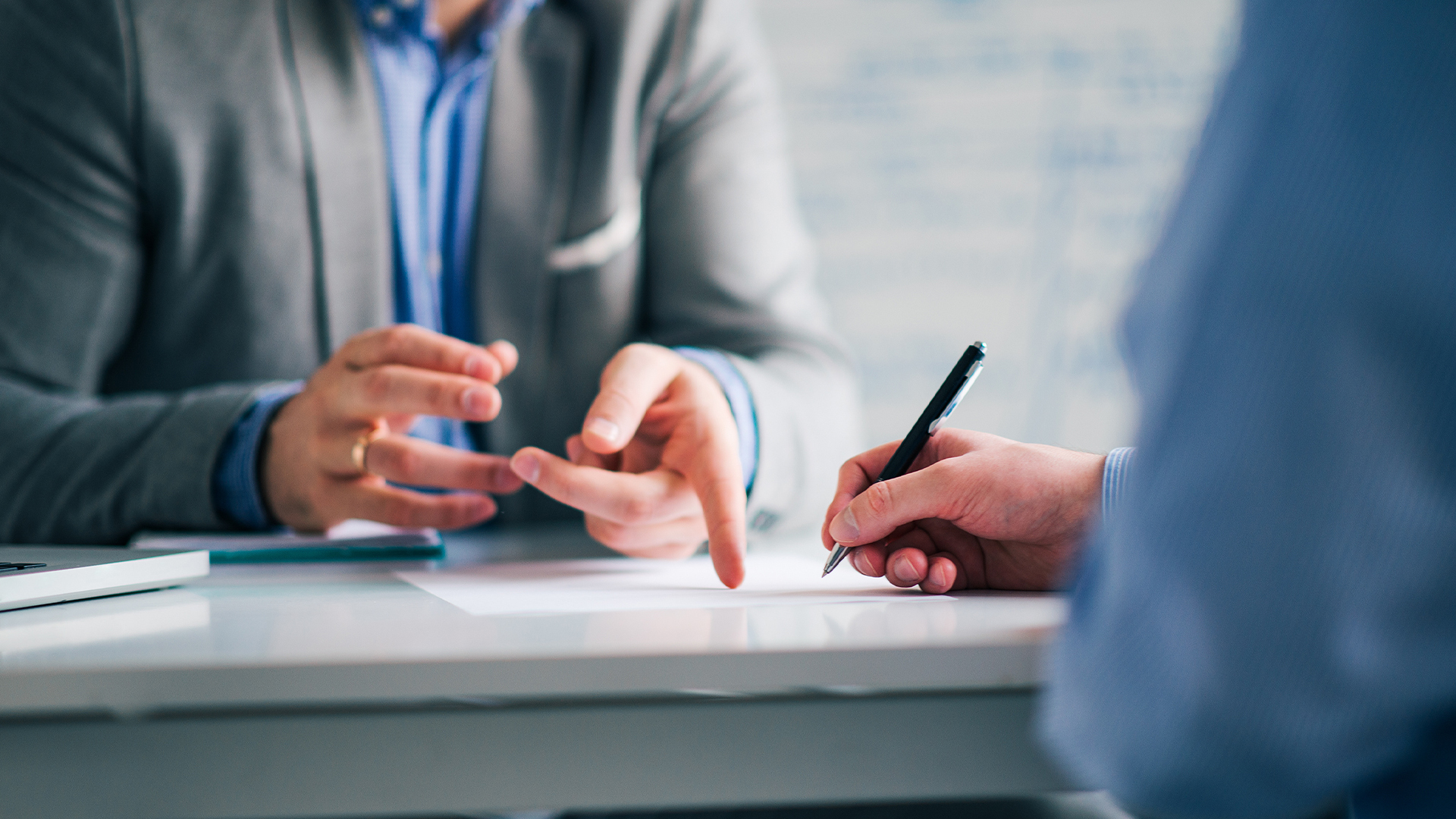 Business consultant and customer on a meeting in the office, signing contract.