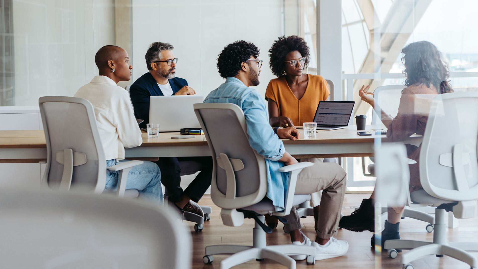 Creative business meeting of professionals brainstorming ideas in a collaborative boardroom